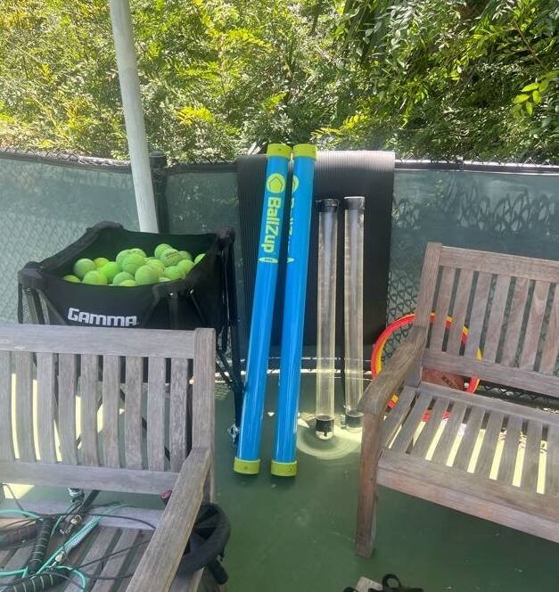 Live Ball tennis training equipment and ball-feeding tubes on a Los Angeles tennis court
