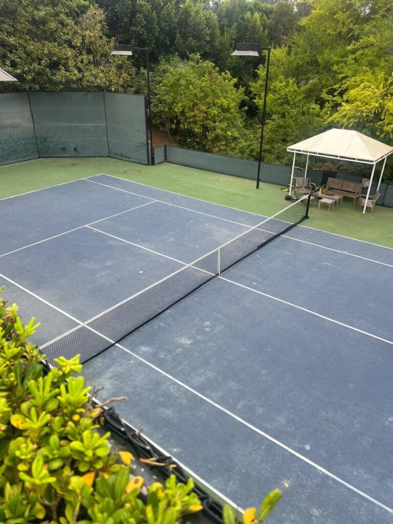 Tennis court in Beverly hills, early morning coaching session.
