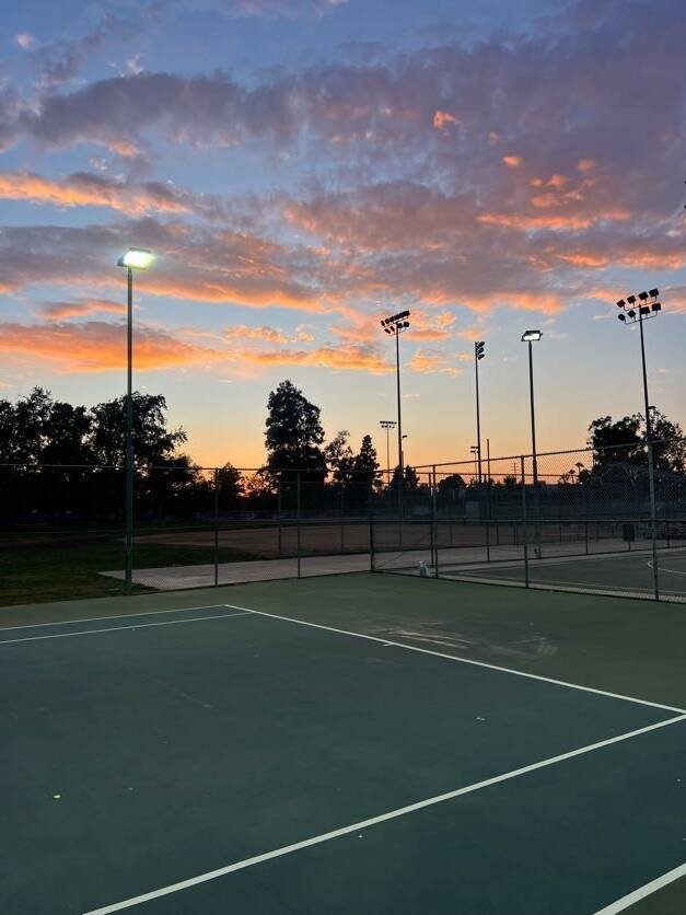 Lighted outdoor tennis courts at sunset for evening tennis practice in North Hollywood