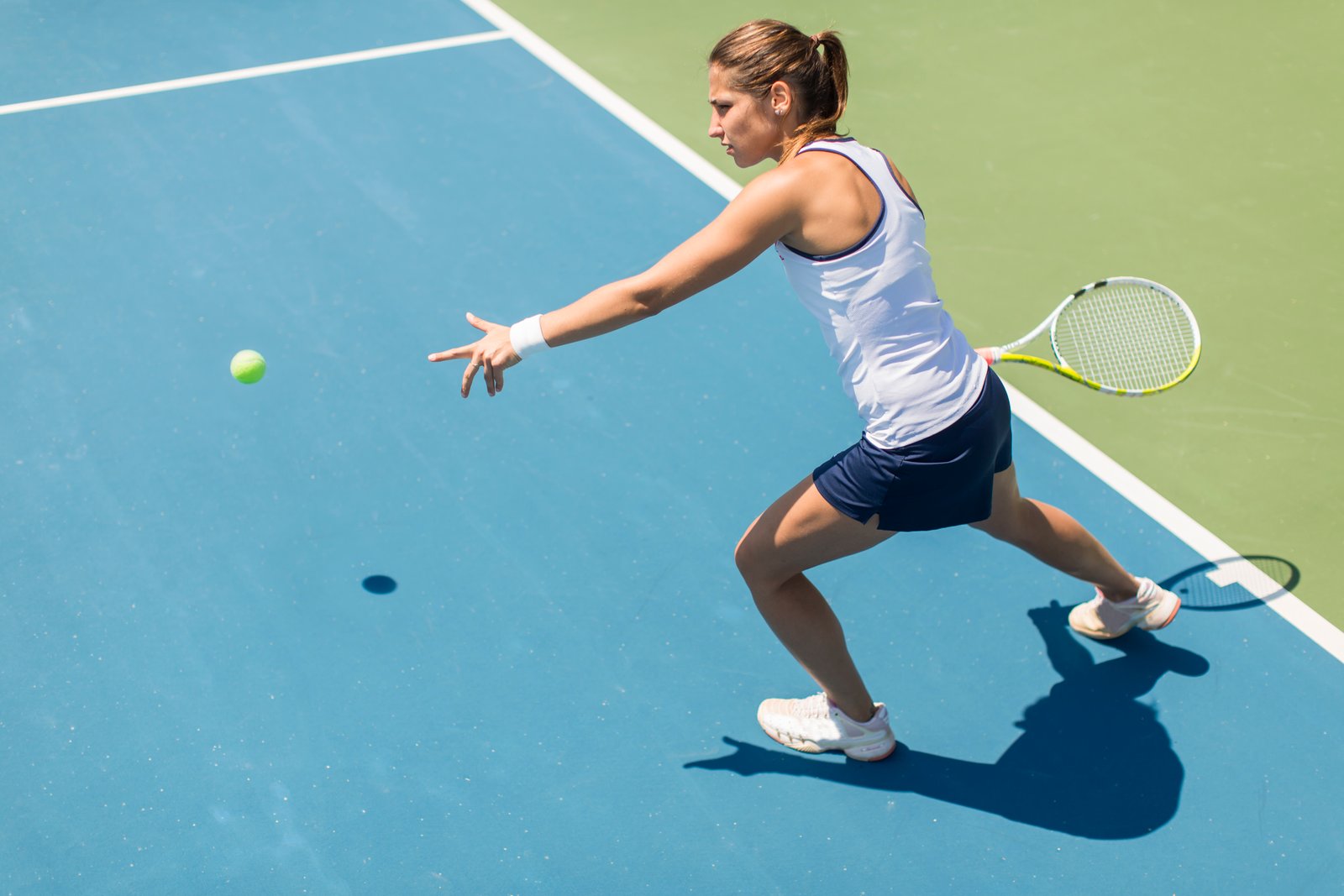 Adult tennis player preparing to hit a ball