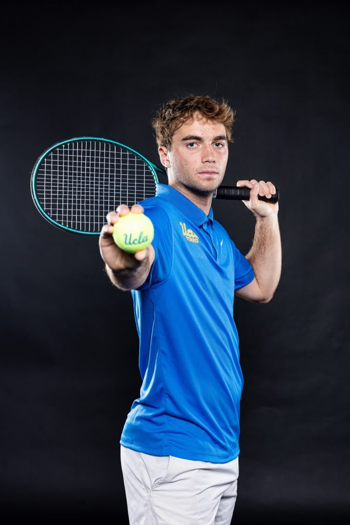 Cassius Chinlund holding a tennis racket