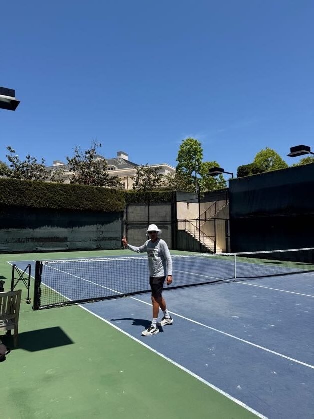 Competitive tennis coach on a private Los Angeles court during high-performance player training