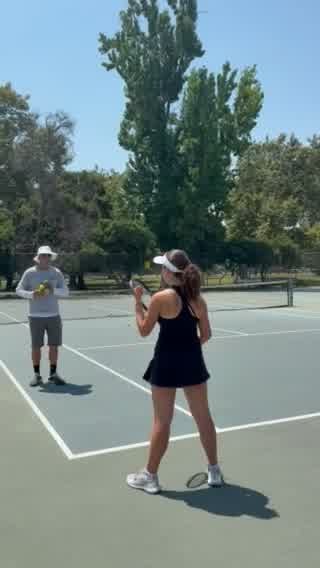 Player practicing racket preparation with a coach during beginner tennis lessons in Los Angeles